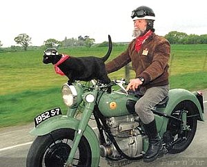 Max Corkill and Rastus the cat on the S-7 Sunbeam, near Christchurch, New Zealand; fund-raising tour 1995