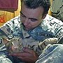 Koshka the cat, with rescuer Staff Sergeant Jesse Knott in Afghanistan