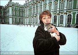 One of the Hermitage cats and the Winter Palace behind, St Petersburg, Russia