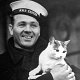 Ship's cat Scouse of HMS Exeter, with Herbert Chalkley
