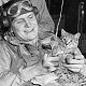 Pilots entertain unnamed ship's cat aboard USS Ranger, 1944