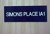 'Simon's place' board on galley door