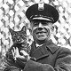 Officer Fink holds Tiger, 1924