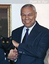 Colin meets Colin - Secretary of State Colin Powell holds his namesake, Apr 2004