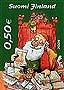 2005 Finnish Christmas stamp of Santa Claus; small cat among animals on chair